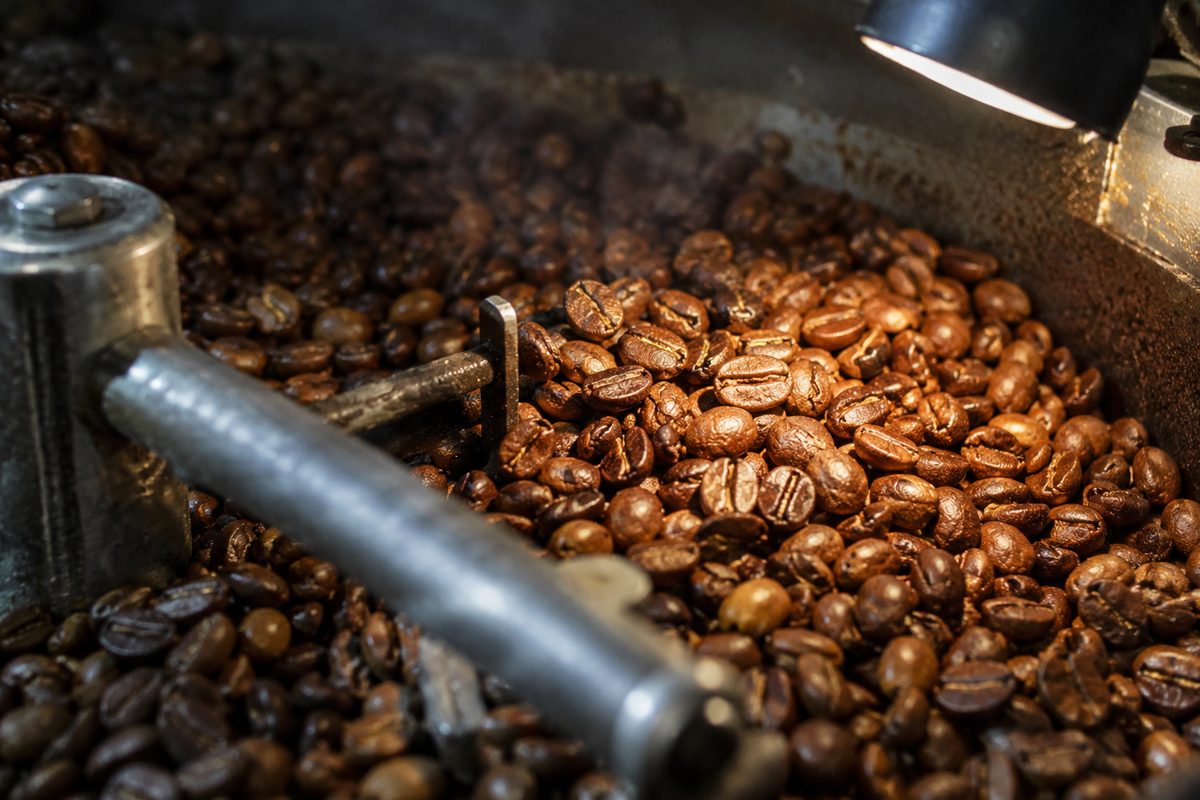 Coffee beans expanding into the light cinnamon brown Maillard phase.